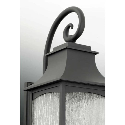Close-up of Traditional Black Hanging Lantern with Two 60W Candle Lights, Classic Vintage Pendant Fixture, clear water seeded glass.