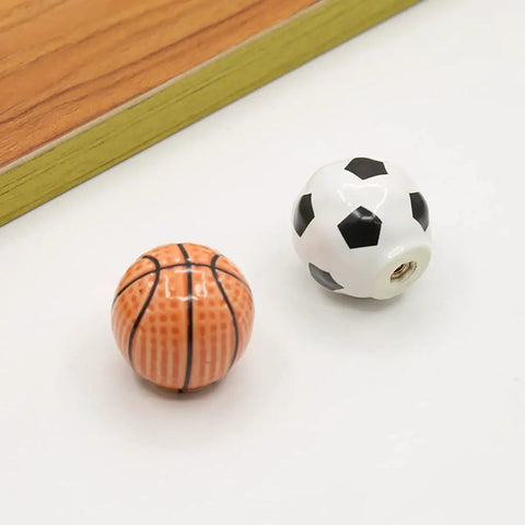 Solid Ceramic Soccer Knobs Four Pack Football Drawer Handles For Kids Bedroom And Man Cave Sports Decor Dresser Cabinet Pulls Easy Install Badass Home Gear featuring soccer and basketball knobs.
