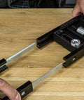 Hands adjusting Butt Hinge Template Kit With Fully Adjustable Router Jig DIY Friendly And Handles All Hinge Sizes And Positions.