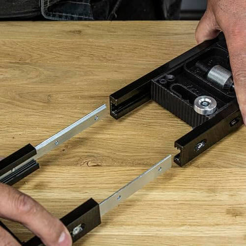Hands adjusting Butt Hinge Template Kit With Fully Adjustable Router Jig DIY Friendly And Handles All Hinge Sizes And Positions.