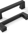 Two matte black cabinet pulls, 20 Pack Matte Black Cabinet Pulls Center To Center Three And Quarters Inches With Four Point Four Inch Overall Length.