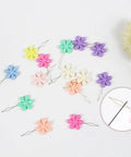 40 Piece Dope Petal Shaped Needle Threader Set In Assorted Colors for hand sewing and crafts, showing colorful threaders.