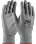 Badass General Duty Nylon Work Gloves With Seamless Knit Shell And Abrasion Resistant Build For Top Shelf Finger Dexterity And All Day Breathable Comfort In Gray Large Pack Of Twelve, showing palms up.