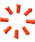 Orange half moon nocks scattered, part of Half Moon Arrow Nocks 50 Pack Plastic Crossbow Nocks For 7.6mm ID Bolts Orange Replacement Tips For Target