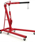 Heavy Duty Folding Hydraulic Engine Hoist Two Ton Portable Garage Cherry Picker with casters for smooth mobility.