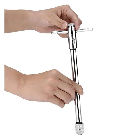 Adjustable Reversible Ratchet Tap Wrench For M5 To M12 Taps, Bidirectional Switch Lets You Thread And Back Out Without Replacing Tools, Ideal For Manual Tapping, Internal Threads, Mechanical Assembly And Mold Repair. Chrome steel tap wrench held by hands