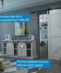 Mini Rustic Sliding Barn Door Hardware Kit In Oil Rubbed Bronze For Cabinets Bookshelves Vanities TV Consoles And More With Fully Included Mounting Hardware For Easy Install 48 Inch Track installed on a cabinet in a living room setting.