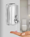 Heavy Duty Stainless Steel Wall Mount Soap Dispenser With Smooth Glide Manual Pump dispensing soap onto hand in bathroom.
