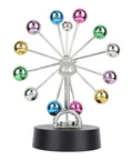 Battery Powered Newton Pendulum Ball Desktop Toy For Science Nerds Newton's Cradle Style Desk Decor Educational Physics Swinging Motion 4 AA Batteries Included, colorful mirrored balls on spokes with black base