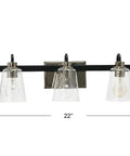 Three Light Vanity Fixture With Seeded Glass Diffusers Matte Black Finish With Polished Nickel Accents Sleek Industrial Vibe