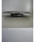 Side view of 11.75 Inch Marble Lazy Susan Turntable With Vintage Gray Stone Finish, showcasing its sleek design and smooth base.