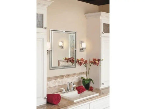 Bathroom setting with Hendrik 12 Inch Wall Sconce In Brushed Nickel With Satin Etched Cased Opal Glass flanking a mirror.