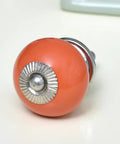 100 Pack Ceramic Orange Round Drawer Knobs Clean Cut Style Goes Hard For Kitchen Cabinets Smooth Dresser Pulls Zero Hassle Install showing a close-up of a ceramic knob.
