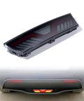 Badass Smoked Rear Bumper DRL And Brake Lamp For 2020 To 2023 Tesla Model Y showing tail light design and glowing brake signal.