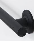 Close-up of 24 Inch Straight Shower Grab Bar Matte Black Stainless Steel With Concealed Flanges for a sleek look and solid grip.