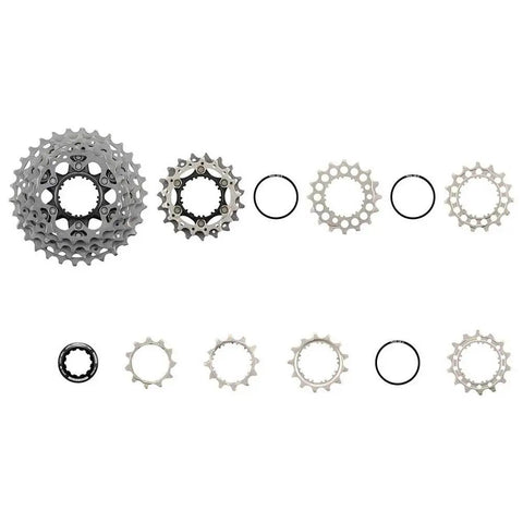 12-Speed Road Bike Cassette 11-30T HG Plus Lightweight Cog Set components displayed in a row showcasing titanium sprockets
