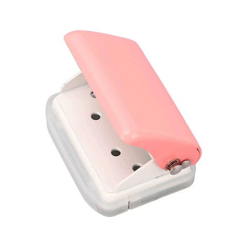 Ultimate Handheld 3-Hole Paper Puncher with 5-Sheet Capacity, Super Easy Alignment for Spot-On Holes, pink top view.