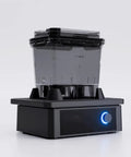 High Octane Oscillating Resin Print Washer For 3D Models Featuring Total No Sweat Four Minute Clean Cycle and Solid Performance With Top Shelf Solvent Bath Soak Station side view with black base and clear reservoir.