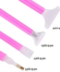 46 Piece DIY Diamond Painting Tools And Accessories Kit With Multiple Pen Sizes Tweezers Glue Diamond Correction And A 28 Bottle Storage Box For Easy Desk Organization Perfect For Adults Craft Lovers At Home, showing pink pickup pens with different tips.