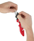 Fastback Press And Flip Utility Knife With Belt Clip And Onboard Wire Stripping Red Set Of 4 Durable Precision Cutting For Pros And Diyers Easy One Hand Deployment Safe Locking Blade With Comfortable Non Slip Grip being held with open blade