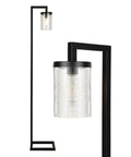 Tall black floor lamp with transparent textured glass shade featuring bulb inside, modern and sleek design.