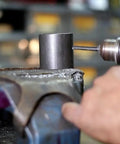 Beefy Extra Long Drill Bit 1-3/16 Inch Diameter, 12 Inch Length, 3/4 Inch Shank, HSS drilling into metal piece