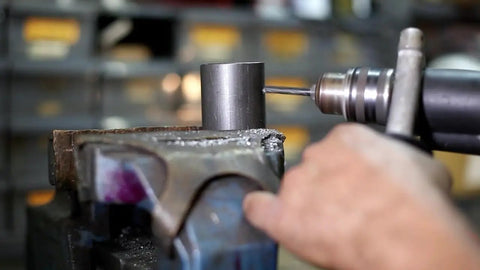 Beefy Extra Long Drill Bit 1-3/16 Inch Diameter, 12 Inch Length, 3/4 Inch Shank, HSS drilling into metal piece