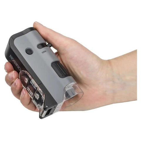 LED UV Pocket Microscope With 100x To 250x Zoom And Smartphone Clip Digiscoping A STEM Ed Tool For Students And Makers Delivers Sharp Images And Easy On The Go Documentation in hand