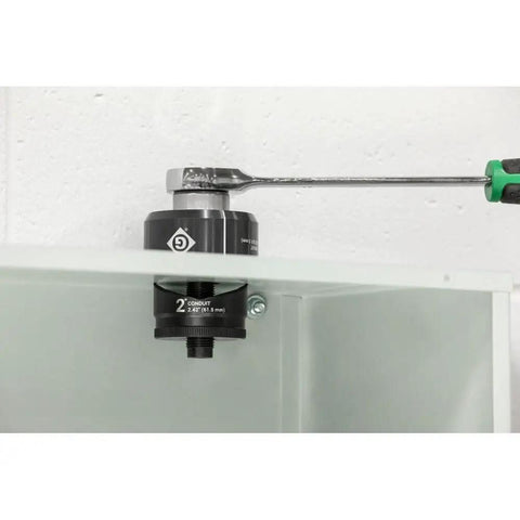 2 Inch Conduit Size Standard Round Knockout Set with knurled grip punch in use, showing laser markings for quick identification and USA made die.