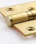 Close-up of a brass hinge, part of a Three Pack Soft Close Door Hinges For Cabinets And Closets, Thickened Quiet Flat Hinge with Free Slot.