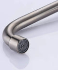 Close-up of spout on Kitchen Wall Faucet With Two Cross Handles In Brushed Nickel Finish Wall Mounted And Adjustable Spread From Three To Nine Inches