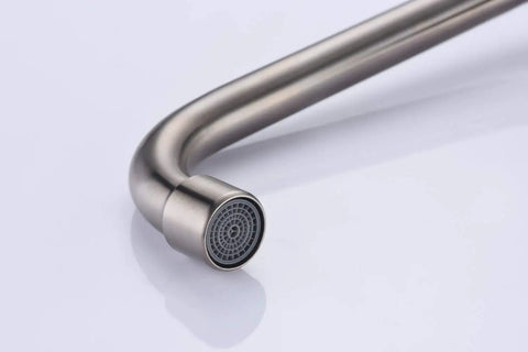 Close-up of spout on Kitchen Wall Faucet With Two Cross Handles In Brushed Nickel Finish Wall Mounted And Adjustable Spread From Three To Nine Inches