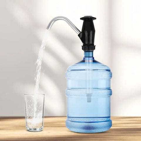 Swap Dead Electric Pumps For This Rugged Hand Operated Drum Pump Designed For Caravan And Rv Sinks delivering water flow into a glass.