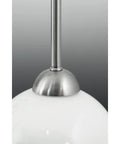 Close-up of Carisa Three Light Chandelier In Brushed Nickel Finish With Glossy White Glass Globes For Modern Living And Dining Rooms