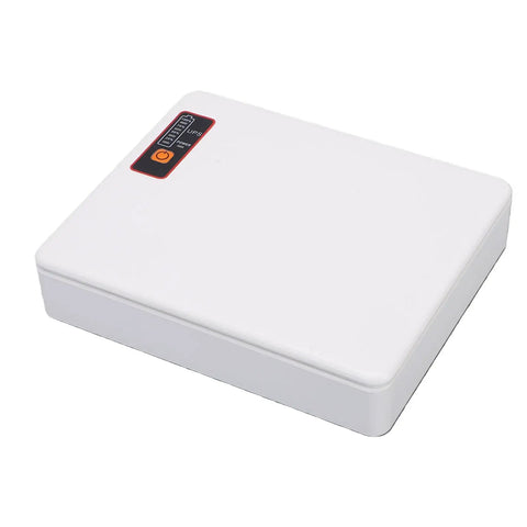 Rock Solid Mini Ups Battery Backup For Router And Modem Keeps Your Home Network Running Smooth During Sudden Power Outages With 20800Mah Capacity Us Wall Plug compact white unit with indicator lights.
