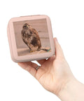 Compact Pink Jewelry Travel Case With Plush Interior Lining held in hand, square-shaped, falcon image on cover, 4x4x2 inch size