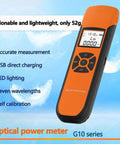 Fiber Optic Power Meter with display, black-orange body, USB charging, seven wavelengths, for testing minus 70 to plus 10 dBm range