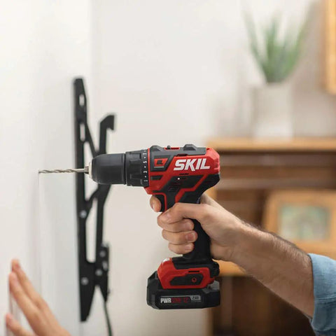 Two Tool Cordless Drill And Right Angle Impact Kit With 12V Brushless Power being used to drill into a wall mount.