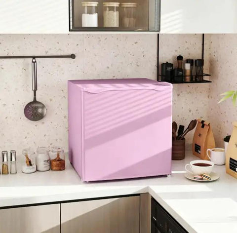Pink Countertop Mini Freezer 1.1 Cubic Feet Compact Upright in a modern kitchen setting with sunlight casting shadows.