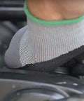 Maxiflex PIP Large Ultimate Micro Foam Nitrile Coated Work Gloves in use for machinery repair, showing black palm and finger tip coating