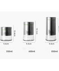 600 Milliliter Airtight Glass Coffee Storage Jar With Stainless Steel Lid displayed among jars of different sizes and dimensions.