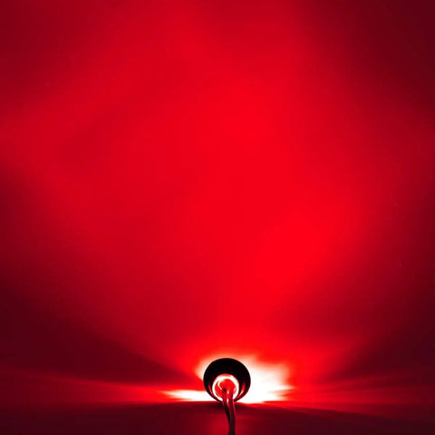 Meerkatt Three Quarters Inch Red LED Side Marker Light With Plug Ends illuminating red light in a dark environment