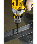 DeWalt cordless drill with cobalt alloy drill bit in chuck; yellow and black tool drilling into metal.