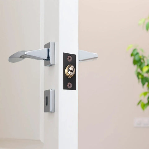 Heavy Duty Adjustable Ball Door Catches Black Brass Roller Latch Tension Hardware For Closet Cupboard And Cabinet With Invisible Design For Home And Office Use mounted on a white door.