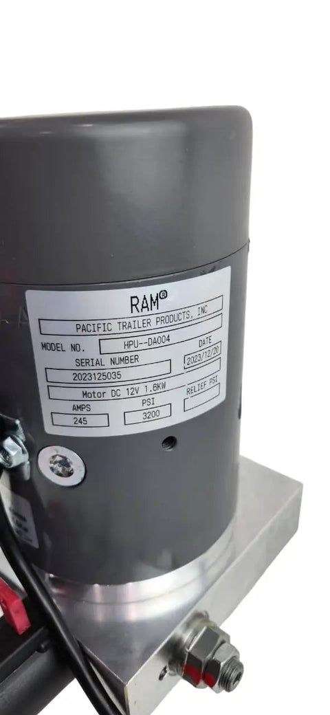 Close-up of Ram Premium Double Acting Hydraulic Pump for Dump Trailers and Tilt Decks 3200 Psi Extension 1500 Psi Retraction 12V DC Motor