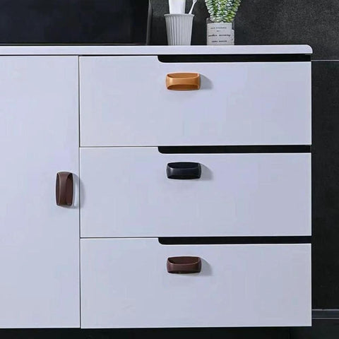 White cabinet with 2 Pack Self Stick Wardrobe Handles With Adhesive For Cabinets Drawers And Doors, black and brown, installed on drawers