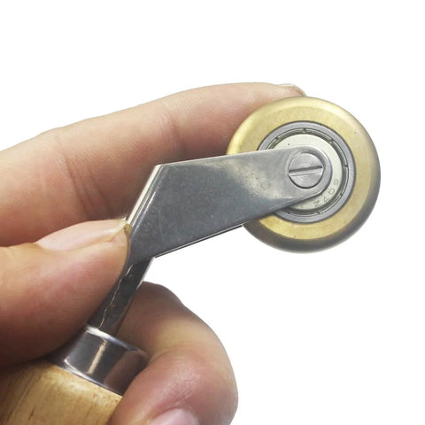 40mm seam roller with wooden handle and brass detail, used for roofing tape installation