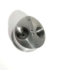 Angled top view of a silver machined metal check valve body for waterjet pump