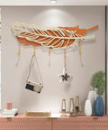 Rock Solid Wall Mount Coat Hooks With Sleek Modern Design Nail Down Easy Setup Versatile Storage Rack For Jackets Hats Keys In Entryway Living Room Or Hallway, featuring a decorative feather design.