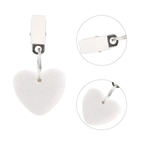 12 Pieces White Heart Shaped Stone Tablecloth Weights With Metal Clips for Indoor Outdoor Use Keeps Table Covers Flat, close-up view